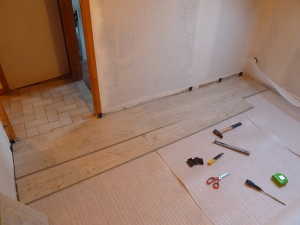 Pose du sol stratifié dans les chambres de nos grands gites.